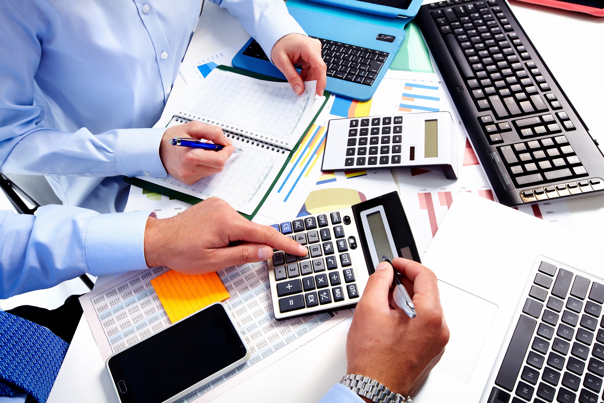 Professionals gathered around a desk